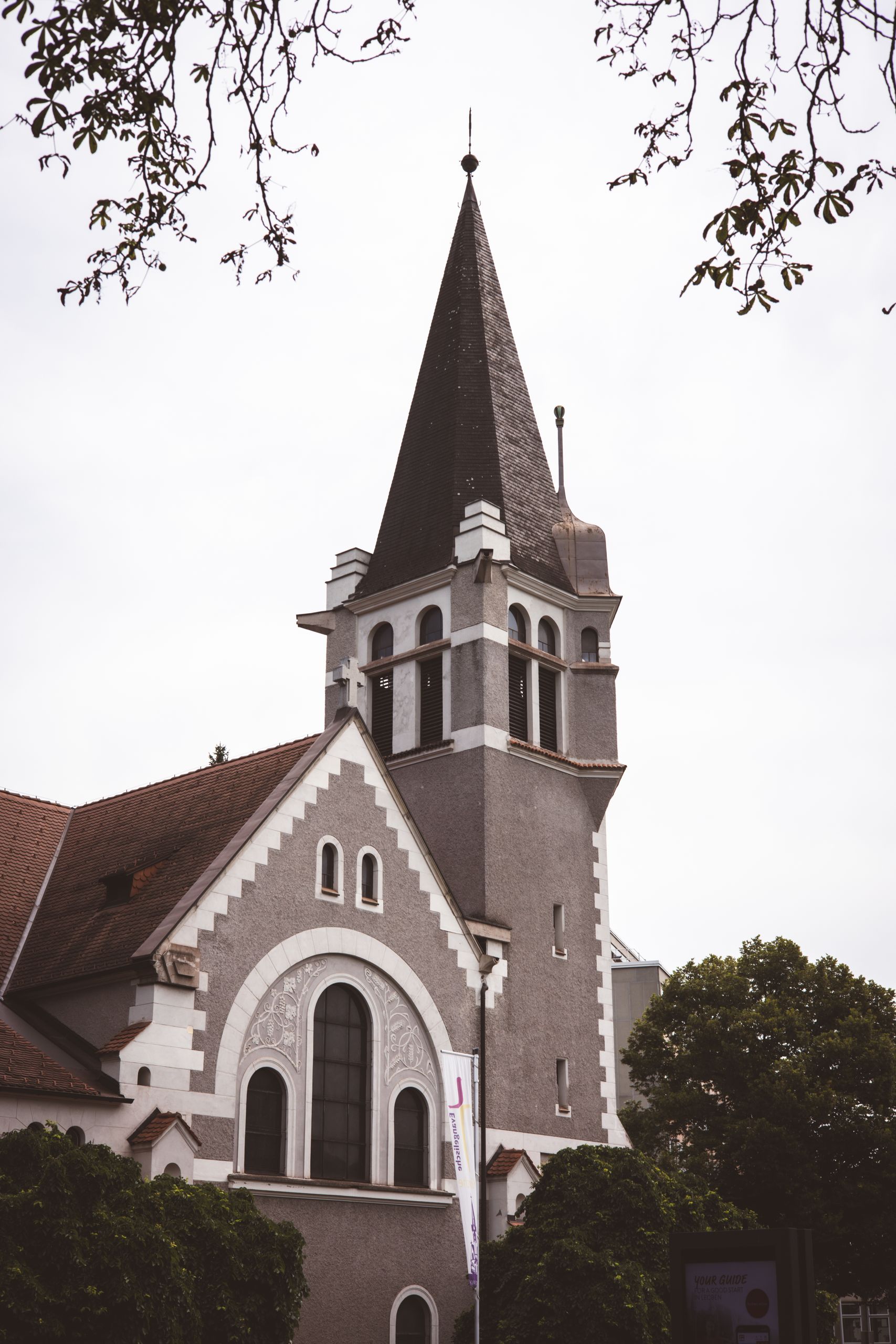 Vertical shot of Gustav-Adolf-Kirche's architectural facade in Leoben, Austria.